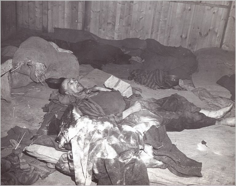 Mauthausen - inmate lies dying on filthy rags